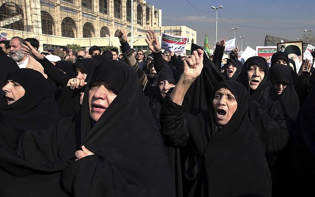 Iranian protesters chant slogans at a rally in Tehran, Iran, Saturday, Dec. 30, 2017. Iranian hard-liners rallied Saturday to support the country's supreme leader and clerically overseen government as spontaneous protests sparked by anger over the country's ailing economy roiled major cities in the Islamic Republic. (AP Photo/Ebrahim Noroozi)