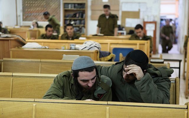 Illustrative: Soldiers of the IDF's ultra-Orthodox Netzah Yehuda Battalion study at the Peles Military Base, in the northern Jordan Valley. (Yaakov Naumi/Flash90)