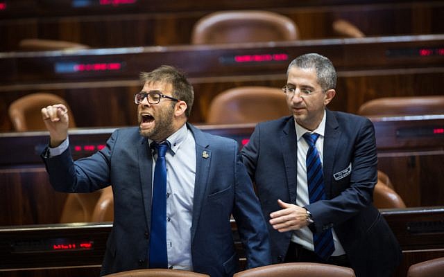Likud Knesset Member Oren Hazan is being taken out as he reacts during a speech by Hanin Zoabi (unseen) during a marathon plenary session in the Israeli parliament regarding the police recommendations bill. December 27, 2017. (Hadas Parush/Flash90)