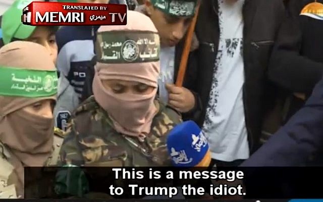 A young boy insults US President Donald Trump and threatens Israel during a Hamas rally in Gaza, December 2017. (Screen capture: MEMRI video)