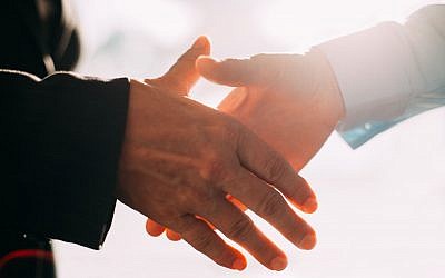 Illustrative image of a handshake (iStock by Getty Images)