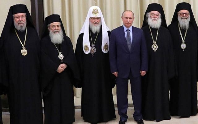 Theophilus lll, Greek Orthodox Patriarch of Jerusalem (second from left), pictured with (from left) the Archbishop of Cyprus, Patriarch Kirill of Moscow, President Vladimir Putin, the Patriarch of Alexandria, and the Patriarch of Antioch, on December 5, 2017. (Courtesy)