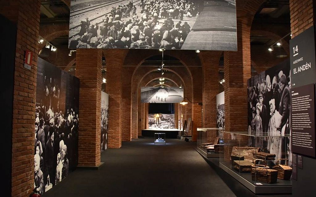 At the Madrid, Spain, installation of a global tour of artifacts from Auschwitz-Birkenau, artifacts from the former Nazi death camp are juxtaposed with some of the victims' belongings (Courtesy of Musealia)