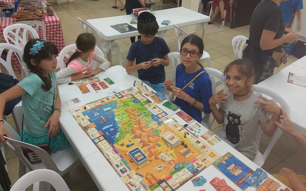 Kids play 'Jewish Luck,' the first Russian-language Jewish board game, created by Konstantin Zinkoff. (Courtesy)