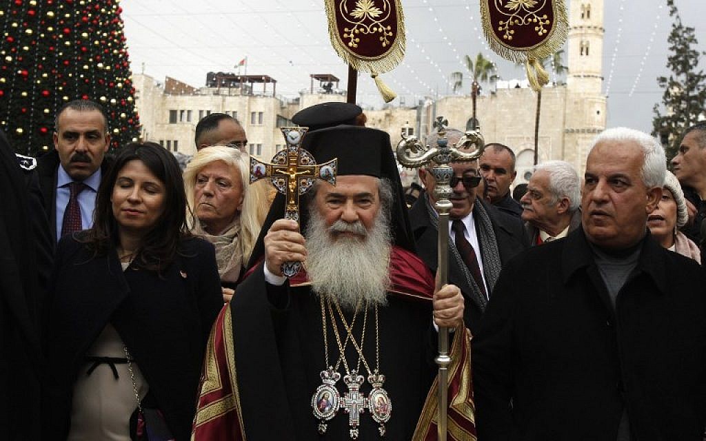 Palestinians mark Orthodox Christmas amid protests of land sales The