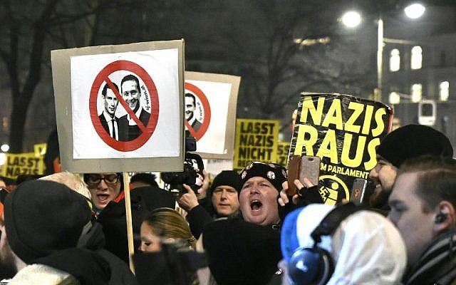 Illustrative: People hold up placards featuring Austria's Chancellor Sebastian Kurz (L) and Heinz-Christian Strache, chairman of the Freedom Party of Austria (FPOE) during protests against Austria's far right holding its so-called Academics Ball in Vienna, Austria on January 26, 2018. (AFP/APA/HANS PUNZ)