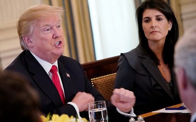 US President Donald Trump (L) next to US Ambassador to the UN Nikki Haley during lunch with members of the United Nations Security Council in the State Dining Room of the White House, January 29, 2018 in Washington, DC. (AFP Photo/Mandel Ngan)