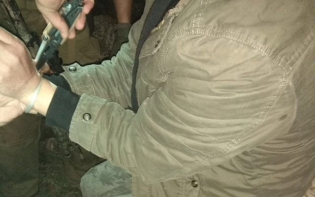 A Palestinian suspect arrested near the West Bank settlement of Itamar, on January 28, 2018. (Samaria Regional Council)