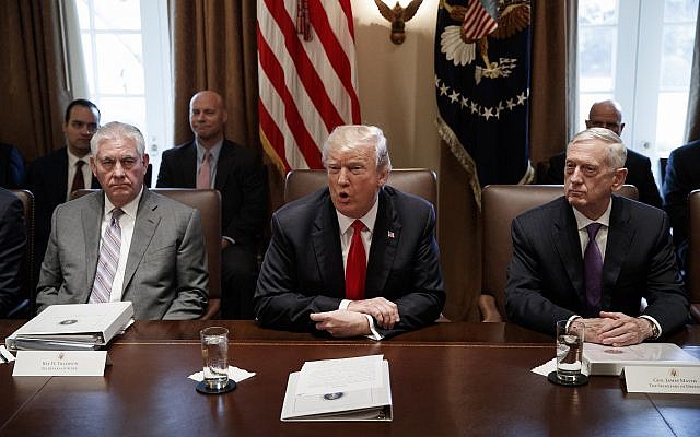 Secretary of State Rex Tillerson, left, and Secretary of Defense Jim Mattis, right, listen as President Donald Trump speaks during a cabinet meeting at the White House, January 10, 2018, in Washington. (AP Photo/Evan Vucci)