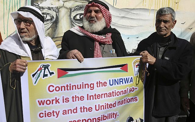Palestinians protest against the US for withholding $65 million from Palestinian aid programs, in front of the UN Relief and Works Agency offices in the Nusseirat refugee camp, central Gaza Strip, January 17, 2018.  (AP Photo/Adel Hana)