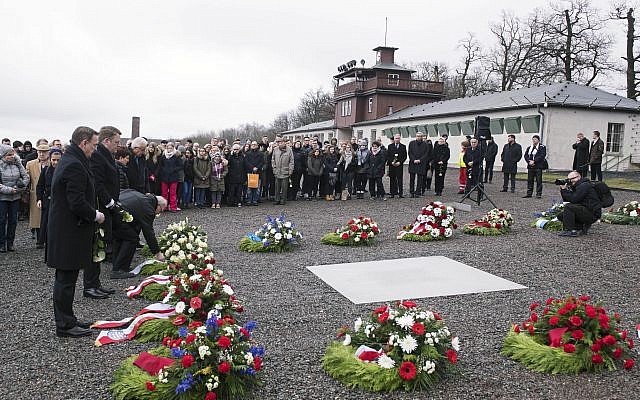 People mourn on the occasion of International Holocaust Remembrance Day in the former Nazi concentration camp Buchenwald, January 26, 2018.  (AP Photo/Jens Meyer)