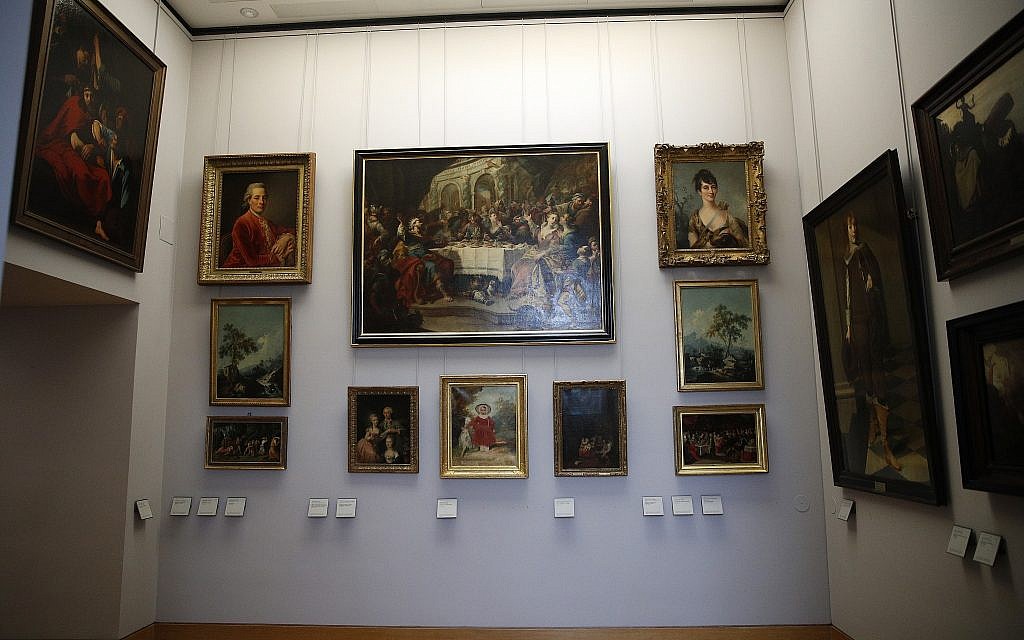 Paintings looted by Nazis during World War II are on display at the Louvre museum in Paris, Tuesday, January 30, 2018. (AP Photo/Christophe Ena)