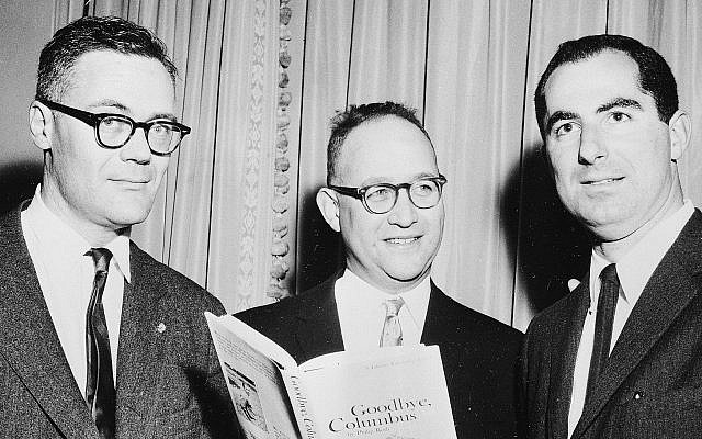 The three winners of the National Book Award are seen as they pose at the Astor Hotel in New York City, March 24, 1960. Robert Lowell, left, was awarded for the most distinguished book of poetry, Richard Ellmann, center, won in the nonfiction categ