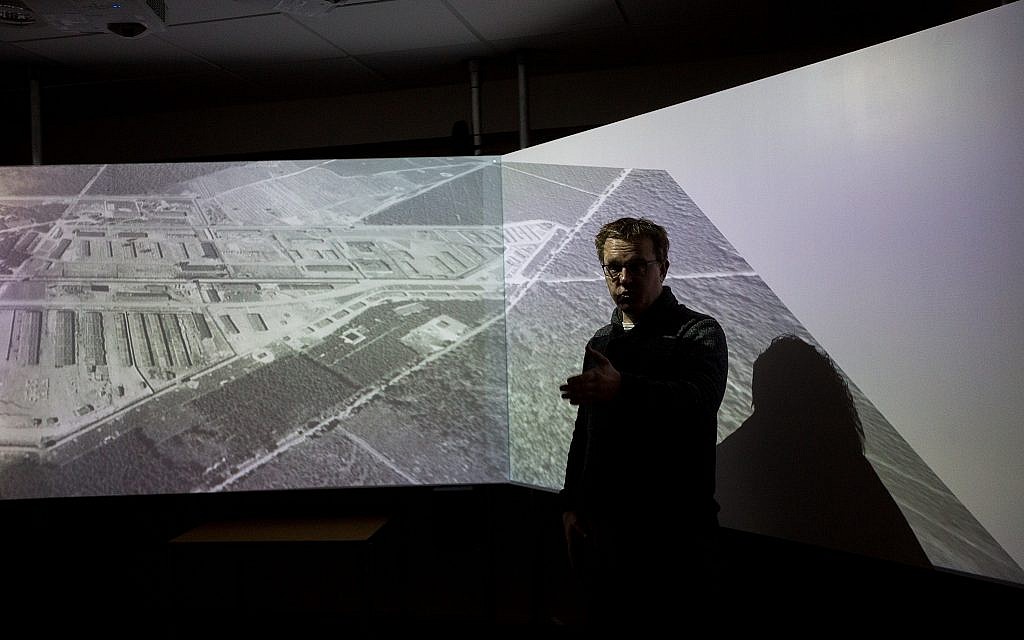 At the Westerbork museum in the Netherlands, Bas Kortholt demonstrates a new virtual reality simulation based on the former Nazi transit camp's appearance during the Holocaust (Elan Kawesch/The Times of Israel)