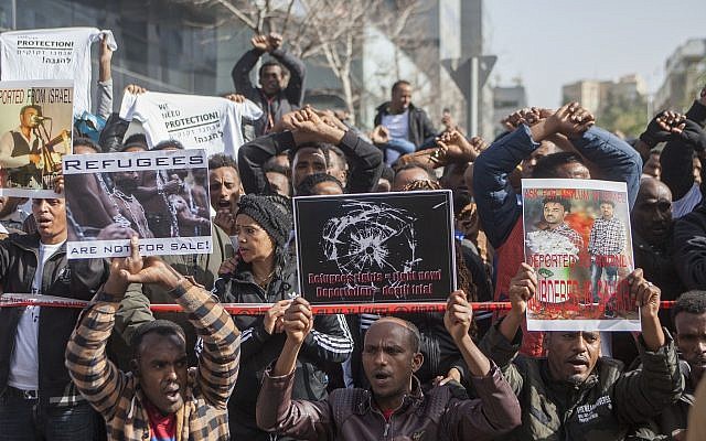 African asylum seekers and human rights activists protest against their planned deportation in front of the Rwandan embassy in Herzliya on January 22, 2018. (Flash90)