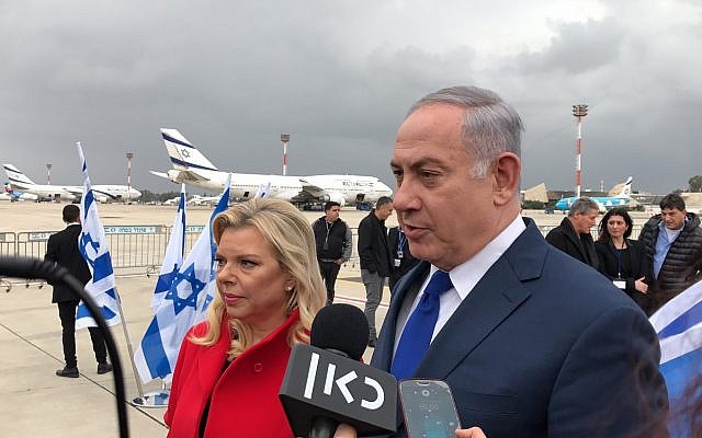 Prime Minister Benjamin Netanyahu, and his wife Sara Netanyahu, at Ben Gurion airport on January 23, 2018. (Jacob Magid/Times of Israel)