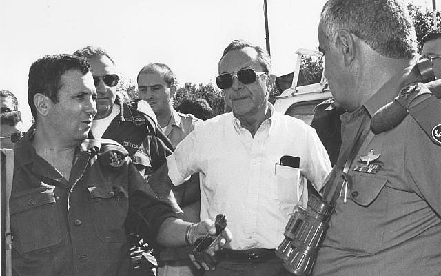 Then-defense minister Moshe Arens, center, meets with then-deputy IDF chief of staff Maj. Gen. Ehud Barak and then-head of the southern command Maj. Gen. Yitzhak Mordechai in 1991. (Ofer Lafler/Israel Defense Forces/Defense Ministry's IDF Archive)