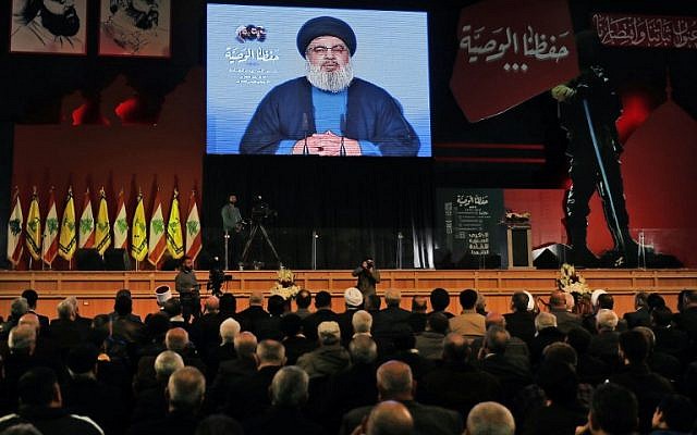 Hezbollah leader Hassan Nasrallah delivers a televised speech during a ceremony in Beirut to commemorate Hezbollah leaders who have been killed, February 16, 2018. (AFP Photo/Joseph Eid)