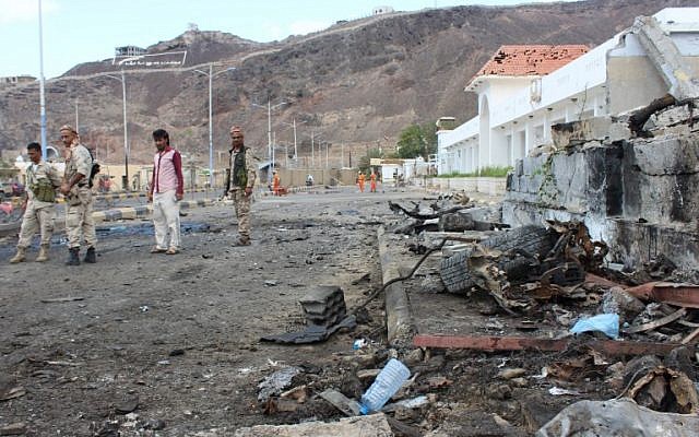 Fighters from the separatist Southern Transitional Council gather on February 25, 2018, at the site of two suicide car bombings that targeted the headquarters of an anti-terror unit the day before, in the southern Yemeni port of Aden. (AFP PHOTO / SALEH AL-OBEIDI)