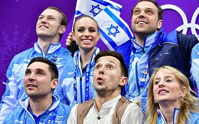 Israel’s Alexei Bychenko (front center) reacts after competing in the figure skating team event men’s single skating short program during the Pyeongchang 2018 Winter Olympic Games at the Gangneung Ice Arena in Gangneung on February 9, 2018. (AFP / Mladen ANTONOV)