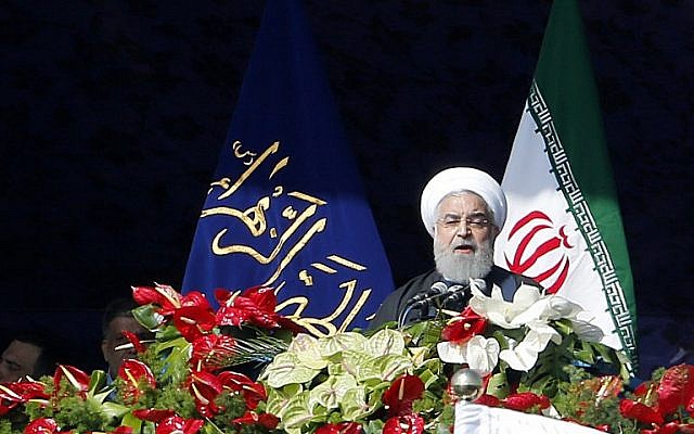 Iranian President Hassan Rouhani delivers a speech at the Azadi Square in the capital Tehran during a ceremony to mark the 39th anniversary of the Islamic revolution, on February 11, 2018. (AFP PHOTO / ATTA KENARE)