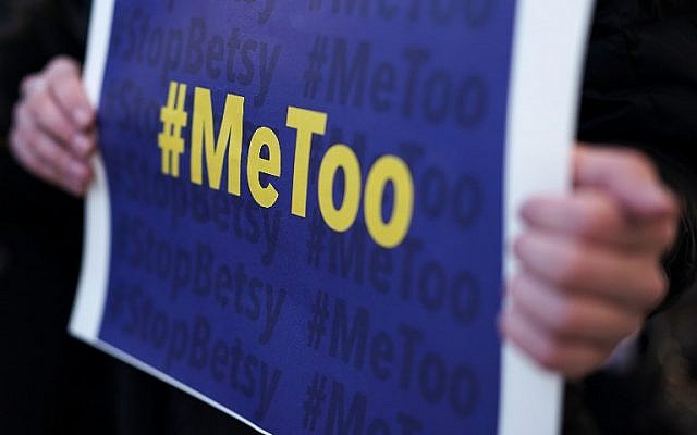 An activist holds a #MeToo sign during a news conference on a Title IX lawsuit outside the Department of Education January 25, 2018 in Washington, DC (Alex Wong/Getty Images/AFP)