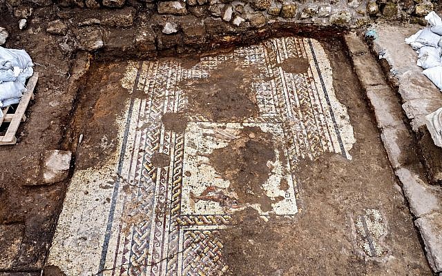 A rare Roman mosaic from the 2nd–3rd centuries CE, bearing an inscription in ancient Greek, uncovered in Caesarea during conservation work by the Israel Antiquities Authority. (Assaf Peretz, Israel Antiquities Authority)