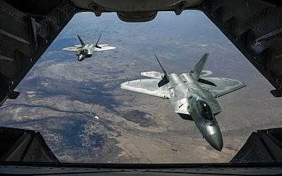 Illustrative: Two US Air Force F-22 Raptors fly over Syria, February 2, 2018. (Air National Guard/ Staff Sgt. Colton Elliott via Department of Defense)