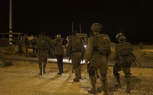 IDF soldiers conduct a raid on the Palestinian village of Nebi Saleh, which is a regular site of protests, arresting nine residents on February 26, 2018. (Israel Defense Forces)