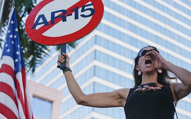 Demonstrators at protest against guns on the steps of the Broward County Federal courthouse in Fort Lauderdale, Florida, on Saturday, February 17, 2018. (AP Photo/Brynn Anderson)