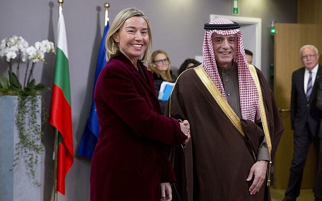 European Union foreign policy chief Federica Mogherini, left, greets Saudi Arabia's Foreign Minister Adel al-Jubeir, after a meeting of EU foreign ministers at the Europa building in Brussels, on February 26, 2018. (AP Photo/ Virginia Mayo)