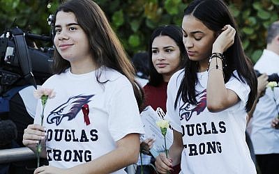 Students walk to class at Marjory Stoneman Douglas High School in Parkland, Florida, Wednesday, February 28, 2018. (AP Photo/Terry Renna)