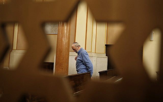 In this photo taken on Friday, Feb. 2, 2018, President of the Jewish Community Bruno Carmi stands inside a synagogue in Verona, Italy, February 2, 2018. (AP Photo/Antonio Calanni)