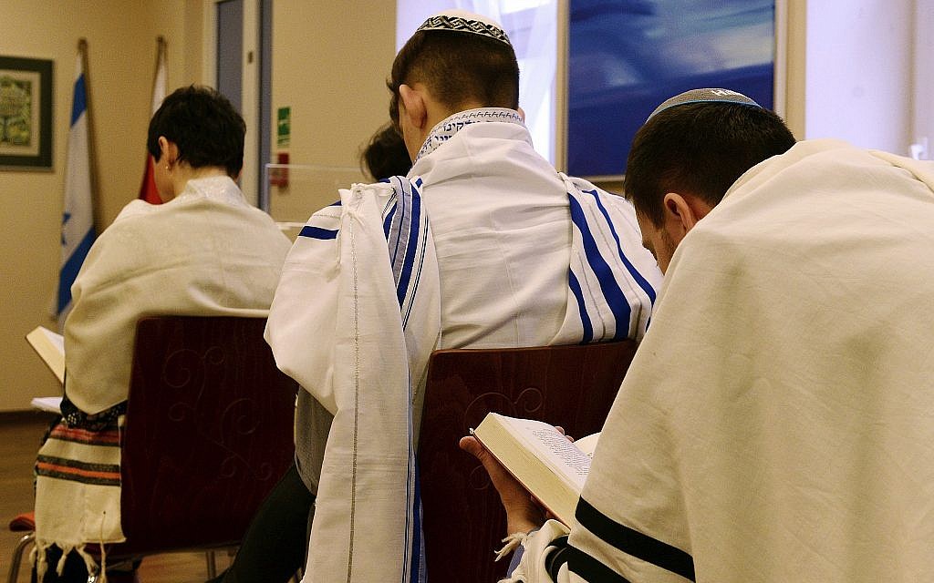 Illustrative photo of Jewish people praying in a synagogue in Warsaw, Poland, on February 10, 2018. (AP Photo/Alik Keplicz)