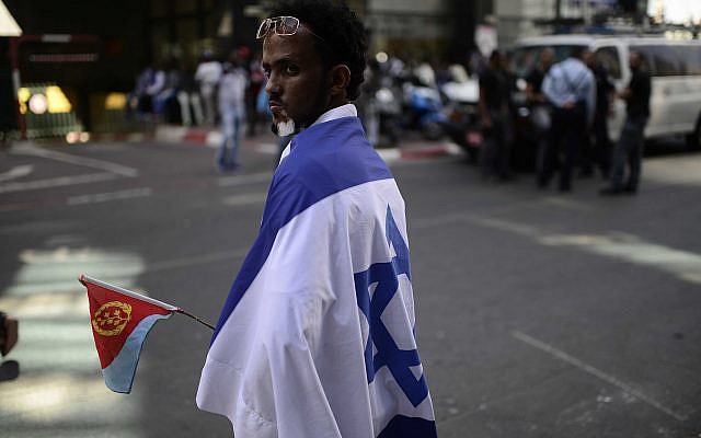 Eritrean migrants protest in front of the European Union embassy in Ramat Gan, near Tel Aviv, calling for the EU to try the Eritrean leadership for crimes against humanity, on June 21, 2016. (Tomer Neuberg/Flash90)