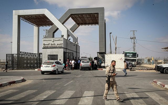 Palestinians wait to cross into Egypt through the Rafah border crossing in the southern Gaza Strip, on August 16, 2017. (Abed Rahim Khatib/Flash90)