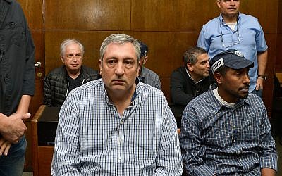 Illustrative: Former Prime Minister's Office manager Nir Hefetz, (center) and Israeli media tycoon Shaul Elovitch (left back) and Eli Kamir (right back) seen at the courtroom for the extension of their remand in Case 4000, at the Tel Aviv Magistrate's Court, February 26, 2018. (Flash90)