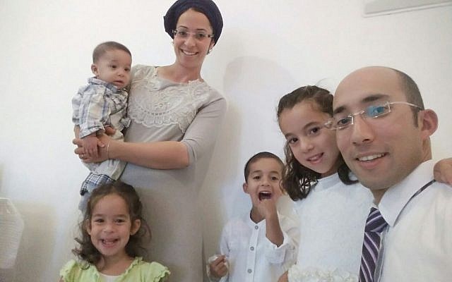 Itamar Ben-Gal, who was murdered by a Palestinian terrorist on February 5, 2018, pictured with his wife and family. (Courtesy)