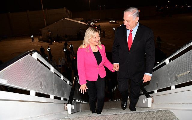 Illustrative: Prime Minister Benjamin Netanyahu and his wife Sarah Netanyahu board a plane at Ben Gurion Airport before departing for Munich, February 15, 2017. (Amos Ben Gershom/GPO)