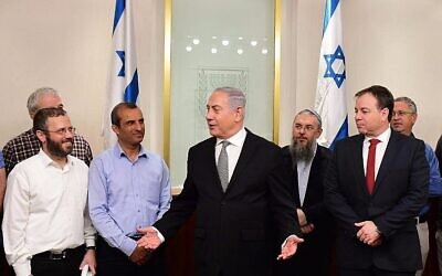 Prime Minister Benjamin Netanyahu (c) meets with settler leaders in his office on February 25, 2018. (Amos Ben Gershom/GPO/File)