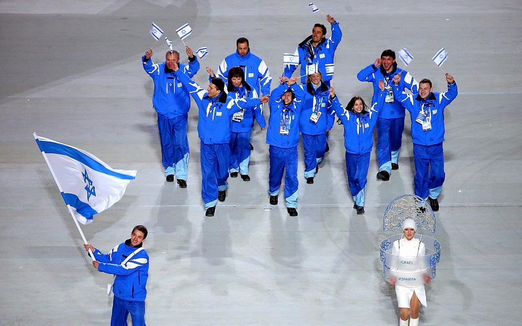 Short track speed skater Vladislav Bykanov, lower left, leading the Israeli Olympic team at the opening ceremony of the Winter Olympics in Sochi, Russia, February 7, 2014. (Quinn Rooney/Getty Images/via JTA)