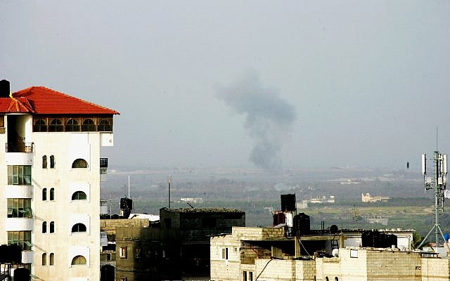 Smoke billows on the Egyptian side of the border, seen from Rafah in southern Gaza, following an explosion, on February 10, 2018.  (Abed Rahim Khatib/ Flash90)