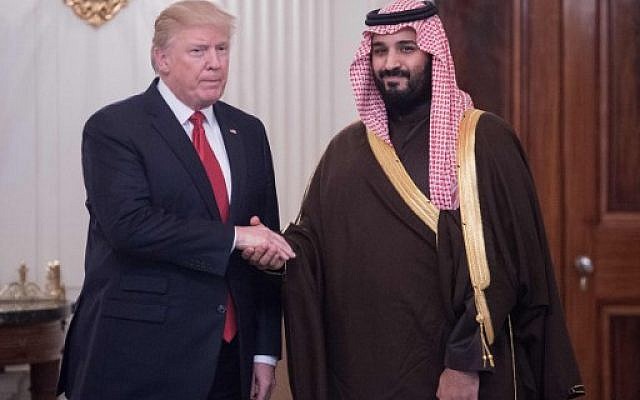 This file photo taken on March 14, 2017 shows US President Donald Trump and Saudi Deputy Crown Prince and Defense Minister Mohammed bin Salman shaking hands in the State Dining Room before lunch at the White House in Washington, DC. (AFP PHOTO / NICHOLAS KAMM)