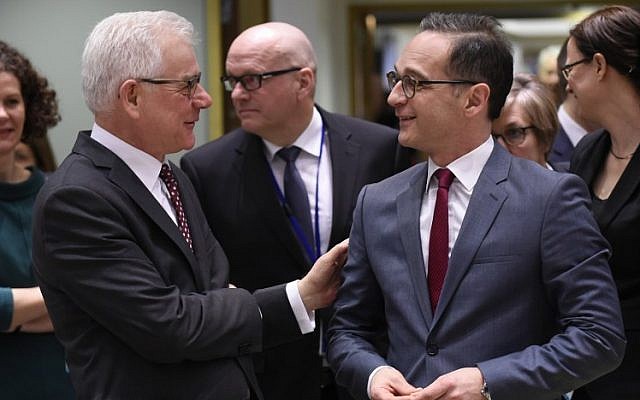 Polish Minister of Foreign Affairs Jacek Czaputowicz, left, speaks with German Minister of Foreign Affairs Heiko Maas, right, ahead of a Foreign Affairs minister meeting at EU headquarters in Brussels on March 19, 2018.  (JOHN THYS/AFP)