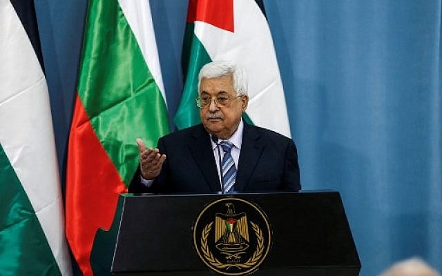 Palestinian Authority President Mahmoud Abbas gestures with his hand during a joint press conference with the visiting Bulgarian president at the Palestinian Authority headquarters in the West Bank city of Ramallah on March 22, 2018. (AFP PHOTO / ABBAS MOMANI)