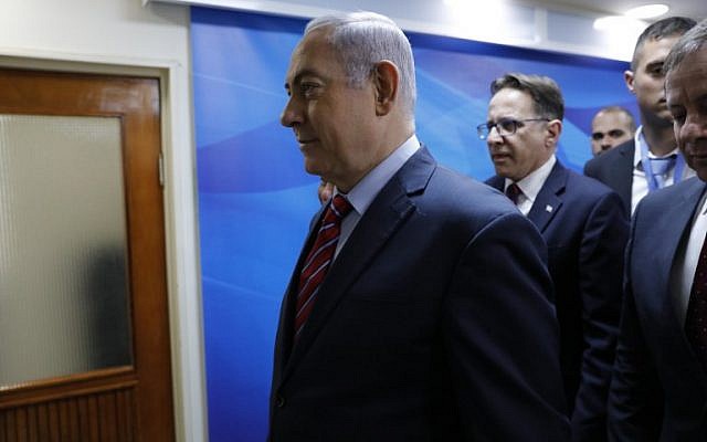 Prime Minister Benjamin Netanyahu arrives for  the weekly cabinet meeting at the Prime Minister's Office in Jerusalem on March 25, 2018. (AFP Photo/AFP Photo and EPA/Abir Sultan)