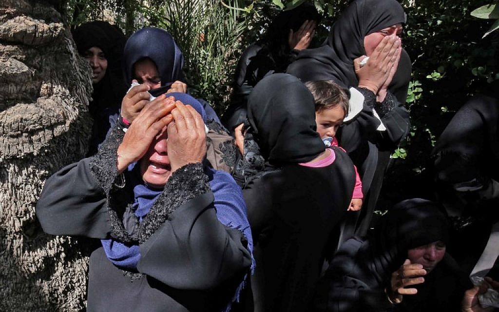 Relatives of 27-year-old Palestinian farmer Omar Samour, who was killed earlier in the day by Israeli tank fire after Israelis said he shot at troops, mourn during a funerary procession in Khan Yunis in the southern Gaza strip on March 30, 2018 (AFP PHOTO / SAID KHATIB)