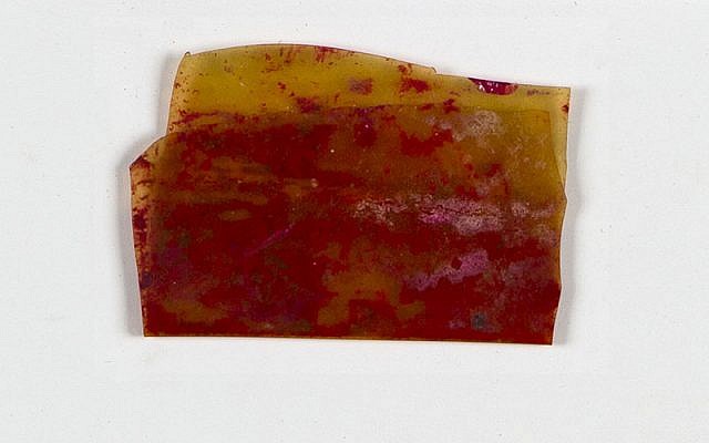 The remainder of a piece of rouge preserved in a celluloid scrap that enabled Rosa Sperling and her daughter Marila to pass the selections in the camps. (Yad Vashem Artifacts Collection)