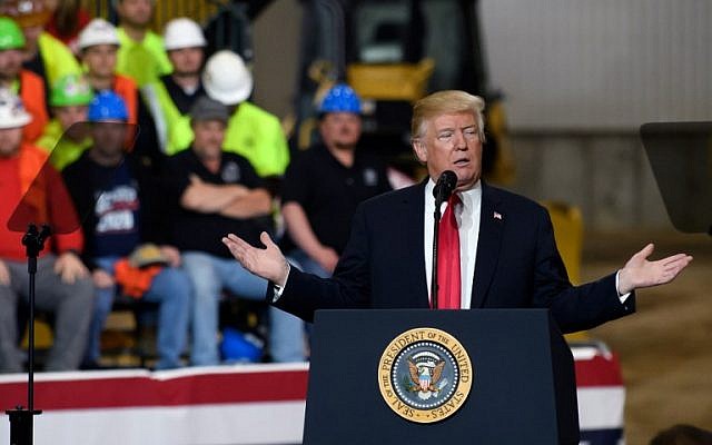 Donald Trump speaks to a crowd gathered at the Local 18 Richfield Facility of the Operating Engineers Apprentice and Training, a union and apprentice training center specializing in the repair and operation of heavy equipment on March 29, 2018 in Richfield, Ohio. (Jeff Swensen/Getty Images/AFP)
