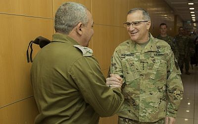 IDF Chief of Staff Gadi Eisenkot, left, shakes hands with the commander of the US European Command Gen. Curtis Scaparrotti at the IDF's Tel Aviv headquarters during the joint US-Israeli Juniper Cobra missile defense exercise on March 11, 2018. (Israel Defense Forces)